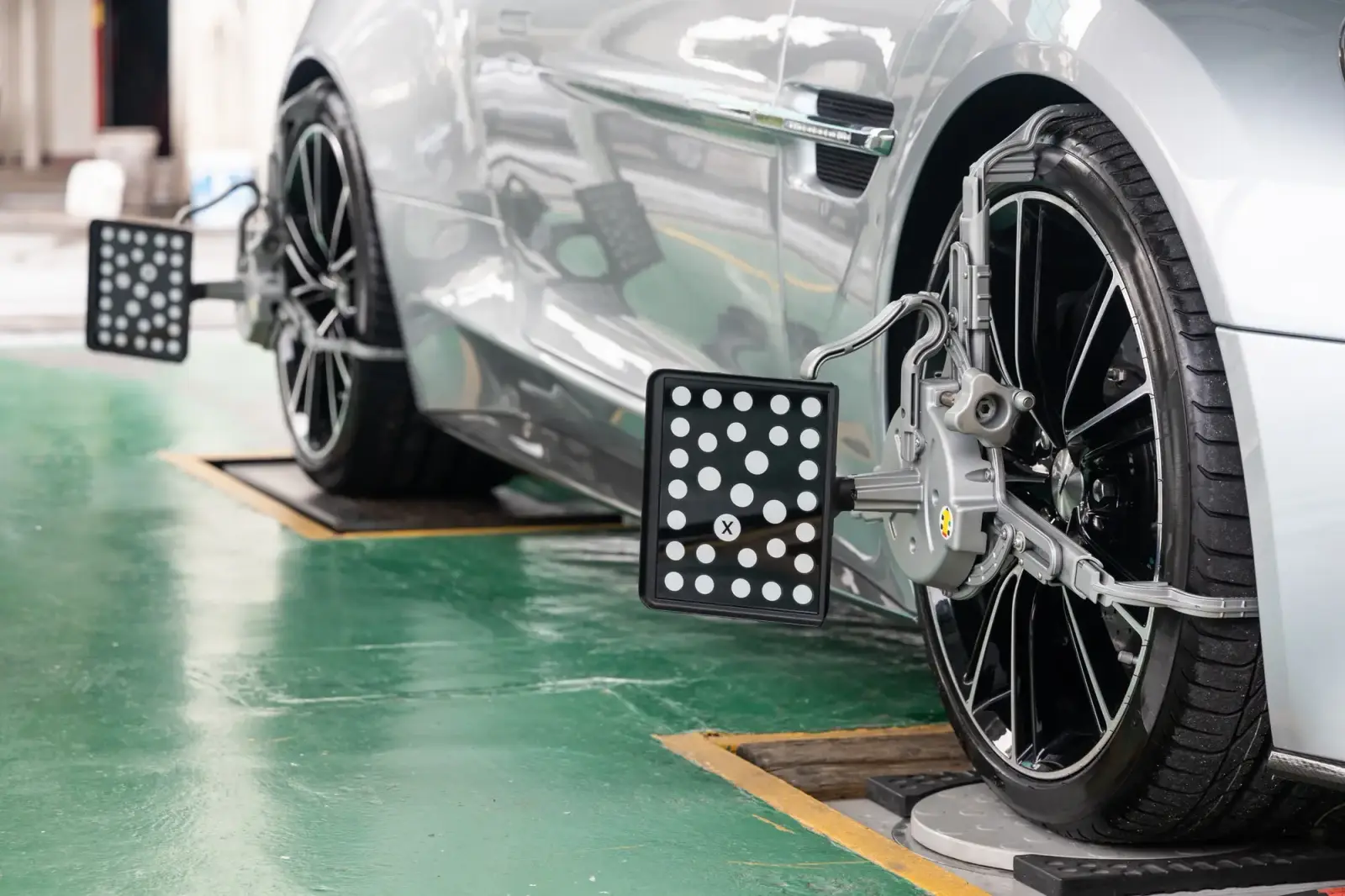 3D wheel alignment system mounted on sports car. Southwest Muffler & Brake, Stafford and Houston.