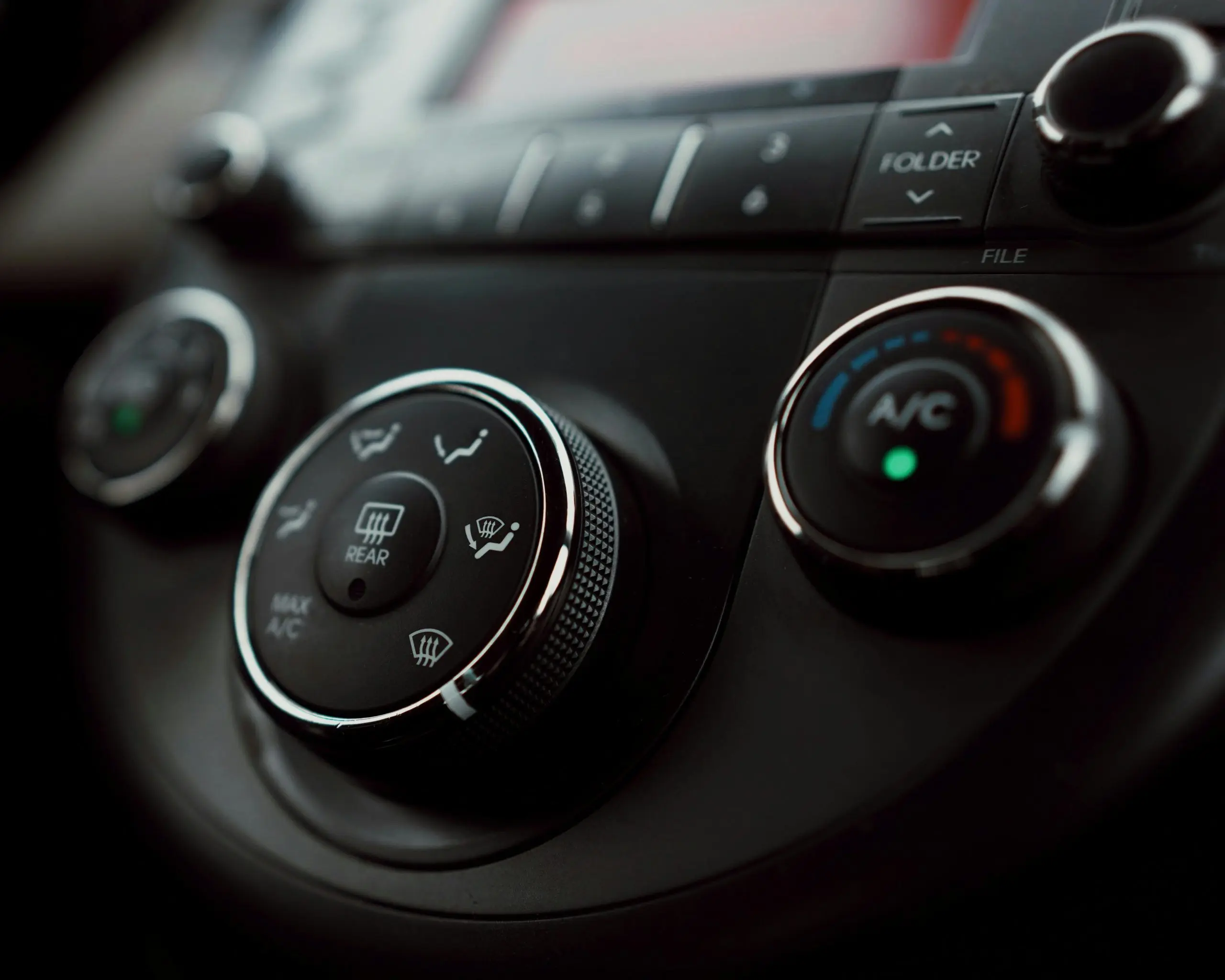 Close-up of car climate control dials. Southwest Muffler & Brake, Stafford and Houston.