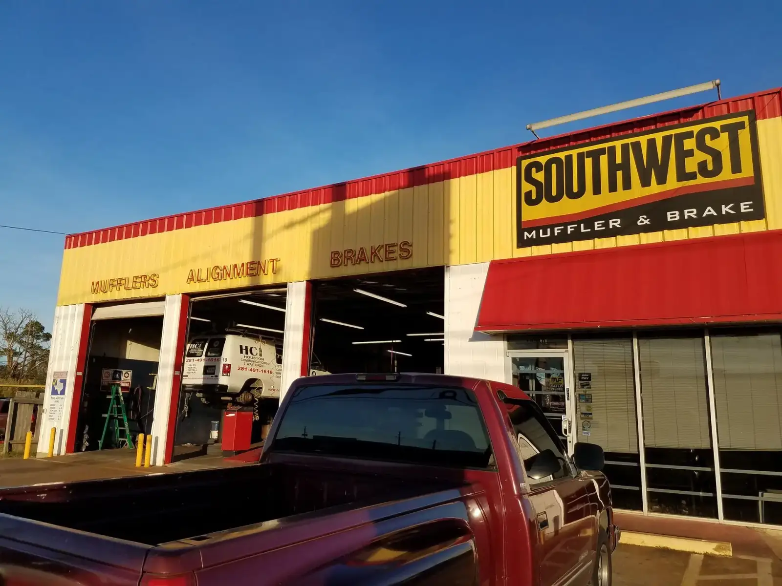 Exterior view of shop garage bays and storefront. Southwest Muffler & Brake, Stafford and Houston.
